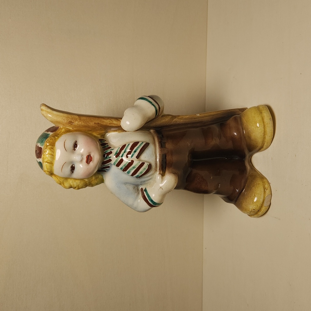 Vintage ceramic unmarked girl figurine with skis